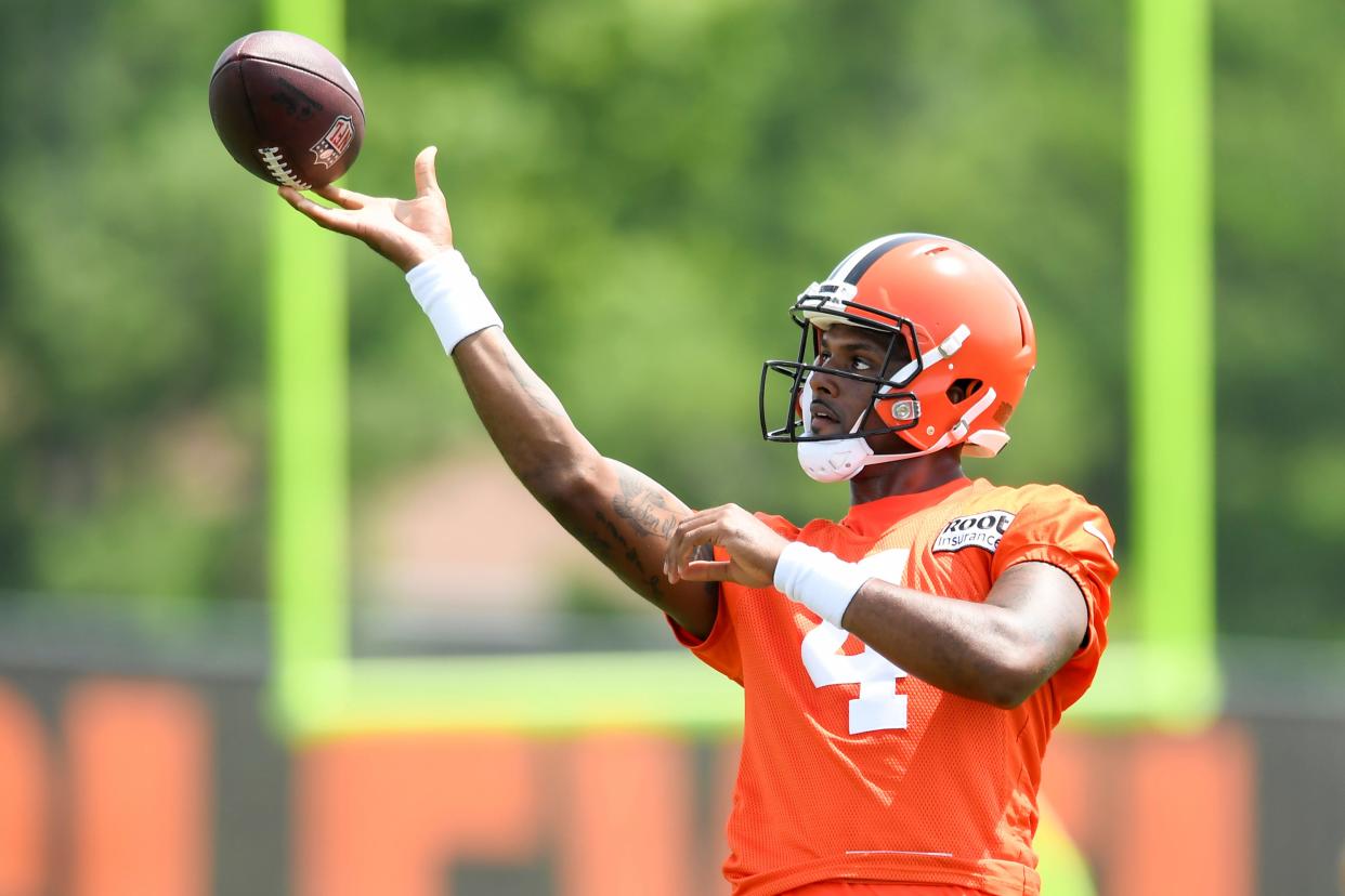 Cleveland Browns quarterback Deshaun Watson throws a pass during the NFL football team's training camp, Monday, August 1, 2022, in Berea, Ohio. Watson was suspended for six games on Monday after being accused by two dozen women in Texas of sexual misconduct during massage treatments, in what a disciplinary officer said was behavior "more egregious than any before reviewed by the NFL."   (AP Photo/Nick Cammett)