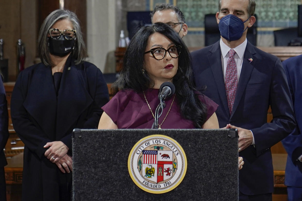 FILE - Los Angeles City Council President Nury Martinez, center, speaks at a news conference at Los Angeles City Hall on April 1, 2022. Los Angeles detectives are investigating whether a recording last year that captured city councilmembers’ racist remarks was made illegally, the police chief said Tuesday, Oct. 25. Disclosure of the recording earlier this month unleashed a citywide scandal just weeks before Election Day. Martinez, resigned in disgrace, while two other councilmembers have resisted widespread calls for their ousters. (AP Photo/Damian Dovarganes, File)