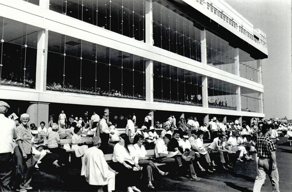 Racing fans begin to fill up the benches along the rail Sept. 1, 1988, on Remington Park's opening day.