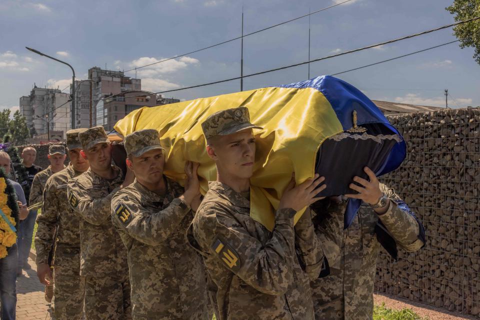 Ukrainian servicemen carry the coffin of Andrii Veremiienko, who was killed fighting Russian troops in the Donetsk region, during a funeral ceremony in Kyiv on Aug. 17, 2023, amid the Russian invasion of Ukraine.