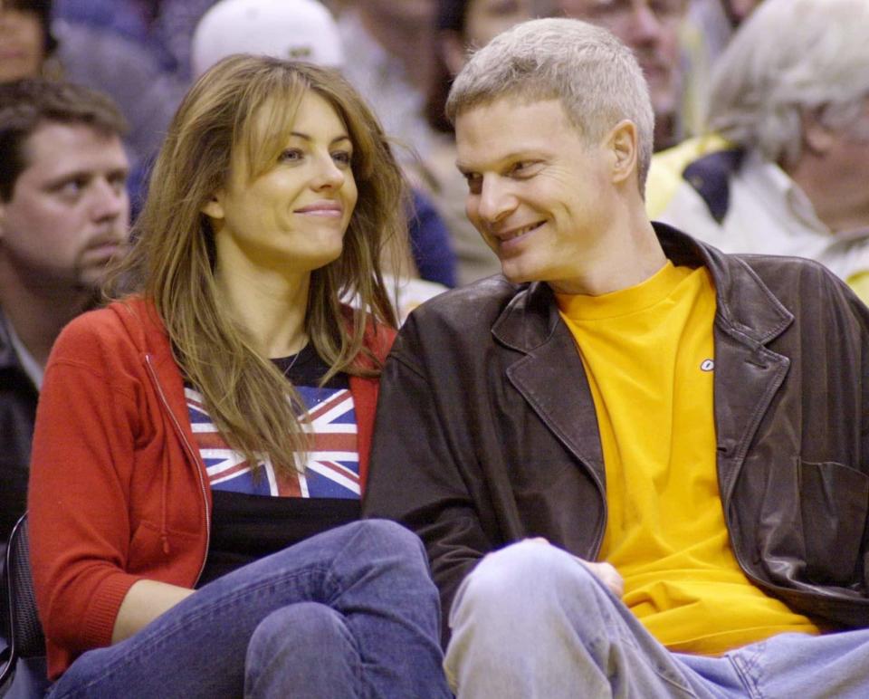 Bing with Liz Hurley at an LA Lakers basketball game in 2001 - Jim Ruymen/Reuters