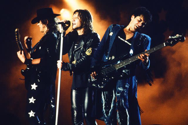 <p>Koh Hasebe/Shinko Music/Getty</p> Richie Sambora, Jon Bon Jovi and Alec John Such of Bon Jovi during Moscow Music Peace Festival 1989 at Luzhniki Stadium, Moscow