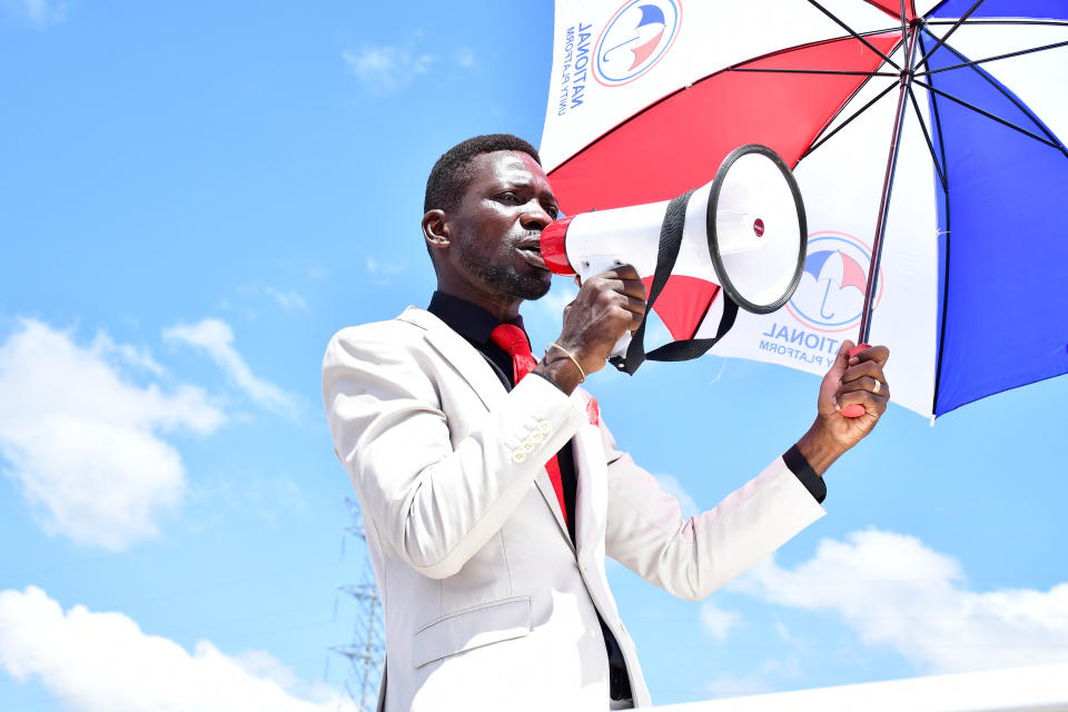 Ugandan politician Robert Kyagulanyi Ssentamu, also known as Bobi Wine, campaigns with a megaphone. Before they could reach the campaign venue in Kumi District, he and his campaign team were tear gassed and subjected to numerous obstacles by Ugandan security forces on November 15, 2020.