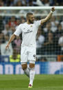 Real's Karim Benzema celebrates after scoring his side's first goal during a first leg semifinal Champions League soccer match between Real Madrid and Bayern Munich at the Santiago Bernabeu stadium in Madrid, Spain, Wednesday, April 23, 2014. (AP Photo/Andres Kudacki)
