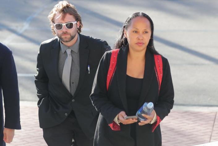 Gaige Grosskreutz walks into the Kenosha County Courthouse with his attorney, Kimberley Motley, during the Kyle Rittenhouse trial last year.
