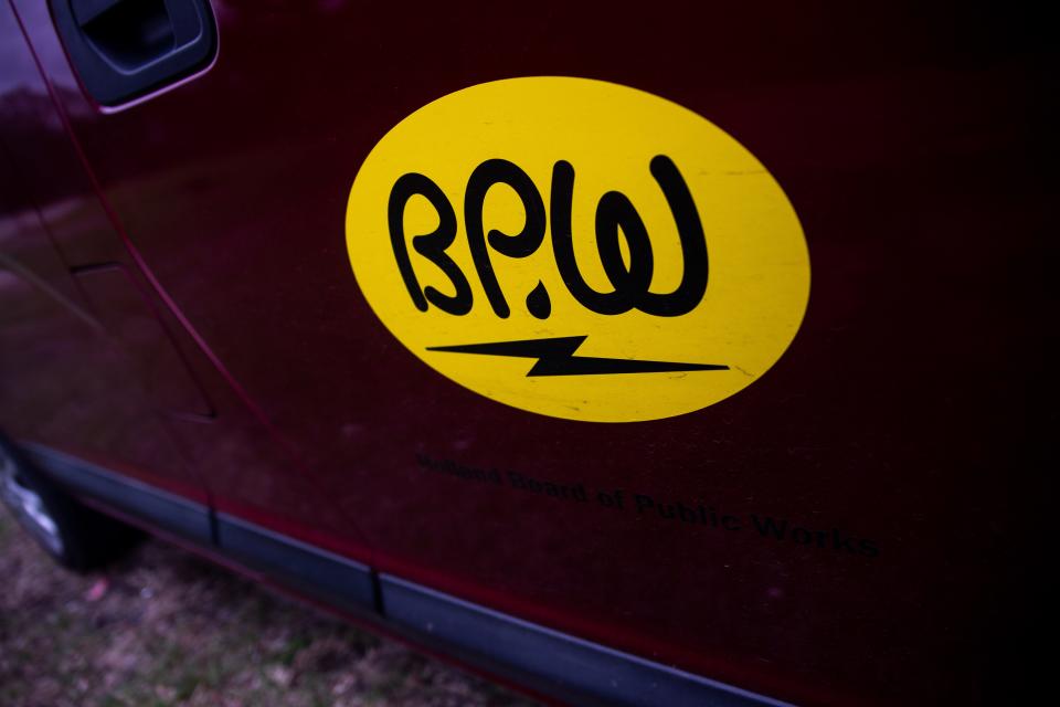 A Holland Board of Public Works van sits parked near a new fiber optic cable Thursday, May 5, 2022, near Butternut Drive in Holland Township.