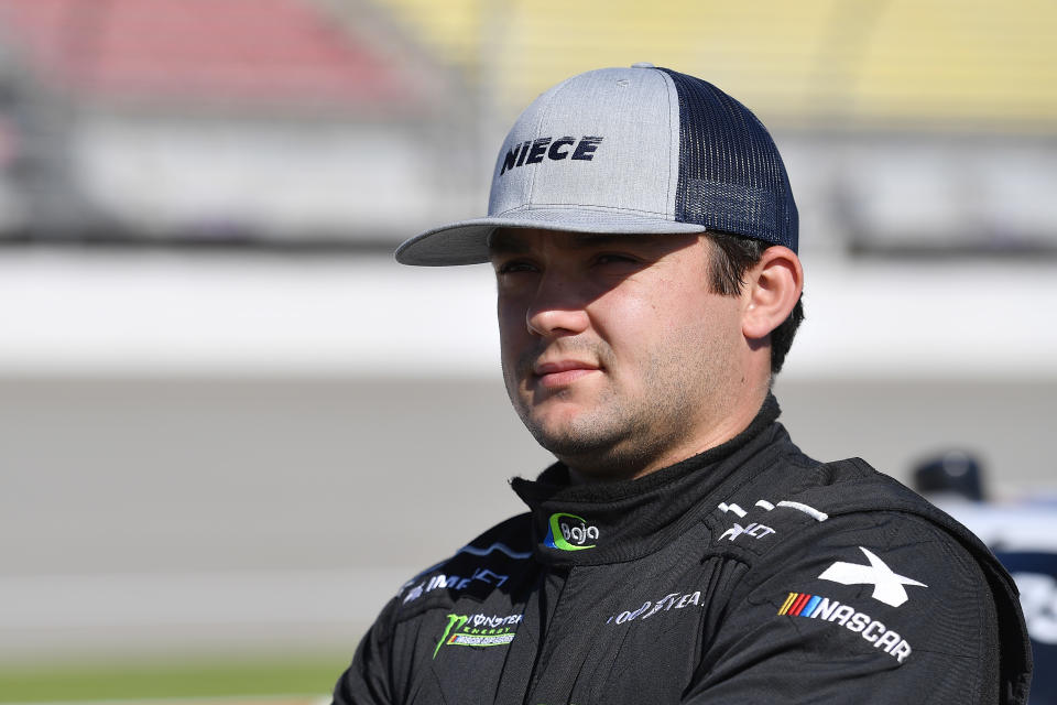 BROOKLYN, MICHIGAN - AUGUST 10: Bayley Currey, driver of the #44 Niece Equipment Chevrolet, stands by his truck during qualifying for the NASCAR Gander Outdoor Truck Series Corrigan Oil 200 at Michigan International Speedway on August 10, 2019 in Brooklyn, Michigan. (Photo by Quinn Harris/Getty Images)