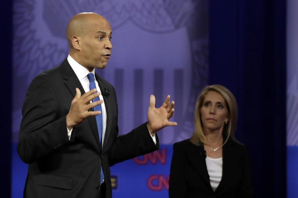 Democratic presidential candidate Sen. Cory Booker, left, D-N.J., speaks during the Power of our Pride Town Hall as with CNN moderator Dana Bash listens Thursday, Oct. 10, 2019, in Los Angeles. The LGBTQ-focused town hall featured nine 2020 Democratic presidential candidates. (AP Photo/Marcio Jose Sanchez)