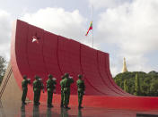 Soldiers stand in attention during a ceremony to mark the 72nd anniversary of the 1947 assassination of independence heroes including Gen. Aung San, the late father of Myanmar leader Aung San Suu Kyi, Friday, July 19, 2019, in Yangon, Myanmar. The country's Independence hero Gen. Aung San and his cabinet were gunned down in 1947. (AP Photo/Thein Zaw)