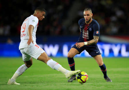 Soccer Football - Ligue 1 - Paris St Germain v AS Monaco - Parc des Princes, Paris, France - April 21, 2019 AS Monaco's Benjamin Henrichs in action with Paris St Germain's Layvin Kurzawa REUTERS/Gonzalo Fuentes