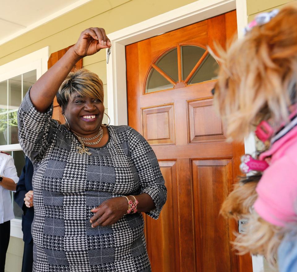 Sonya Kemp holds the key to her new Habitat for Humanity Home on Oct. 12, 2018. Daniel Nielsen, a late University of Alabama graduate, spearheaded the "Raise the Roof for Sonya" campaign that helped build her a new home on the site of her old house, which had been damaged by the April 27, 2011, tornado. [Staff Photo/Gary Cosby Jr.]