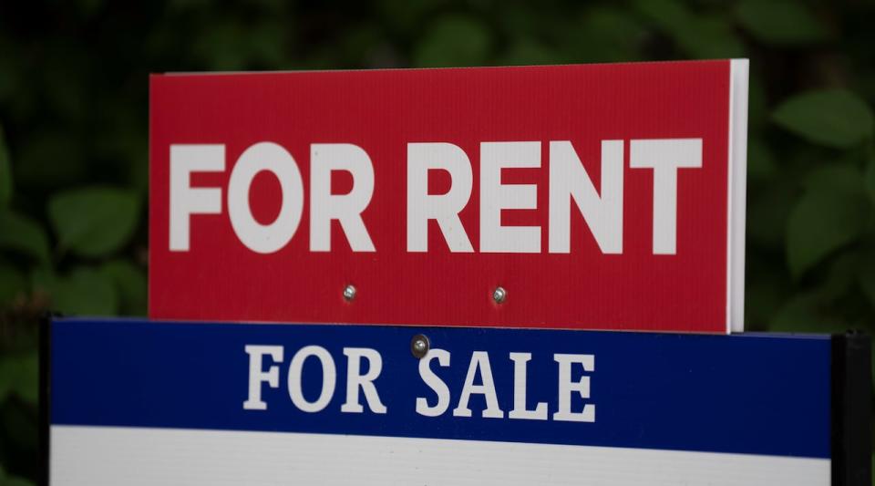 A sign advertises a house as for sale or for rent in Ottawa on June 9, 2023. (Adrian Wyld/The Canadian Press - image credit)