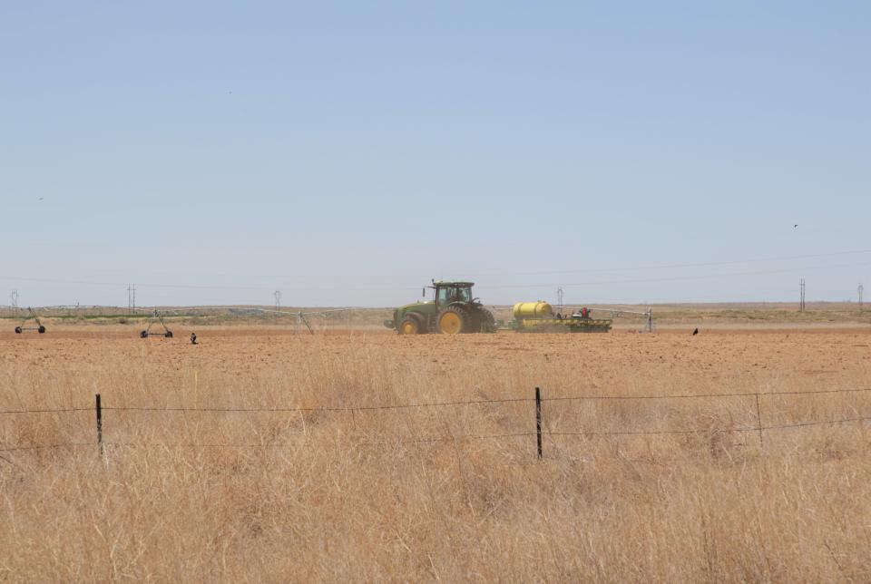 A tractor plows an area on May 18, 2020 at Navajo Agricultural Products Industry. A proposal to convert heavy farm equipment at NAPI to hydrogen fuel is part of a multi-state proposal to the federal government to get funding for a regional hydrogen hub.