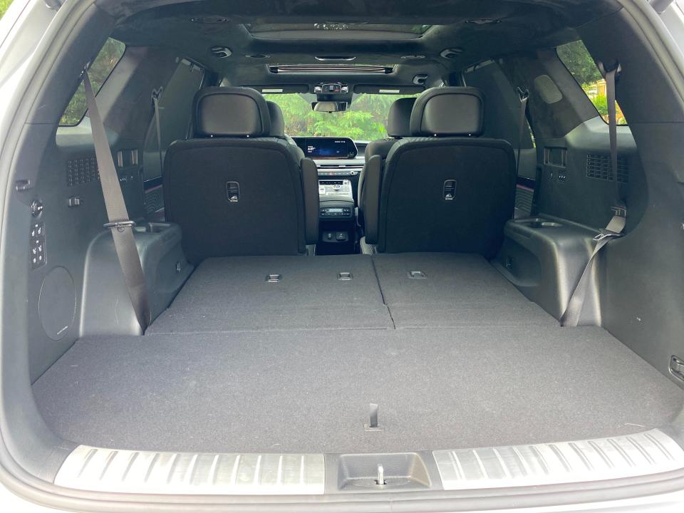 The cargo area of a Hyundai Palisade SUV with the third row of seats folded.