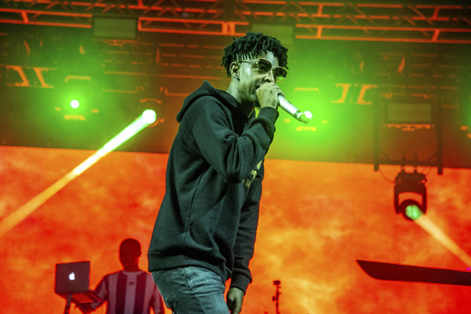 FILE - In this Oct. 28, 2018, file photo, 21 Savage performs at the Voodoo Music Experience in New Orleans. (Photo by Amy Harris/Invision/AP, File)