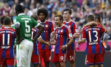 Bayern Munich's Mario Goetze (4th R) celebrates with team mates after a goal against Werder Bremen during their German Bundesliga first devision soccer match in Munich October 18, 2014. Bayern Munich won the match 6-0. REUTERS/Michaela Rehle