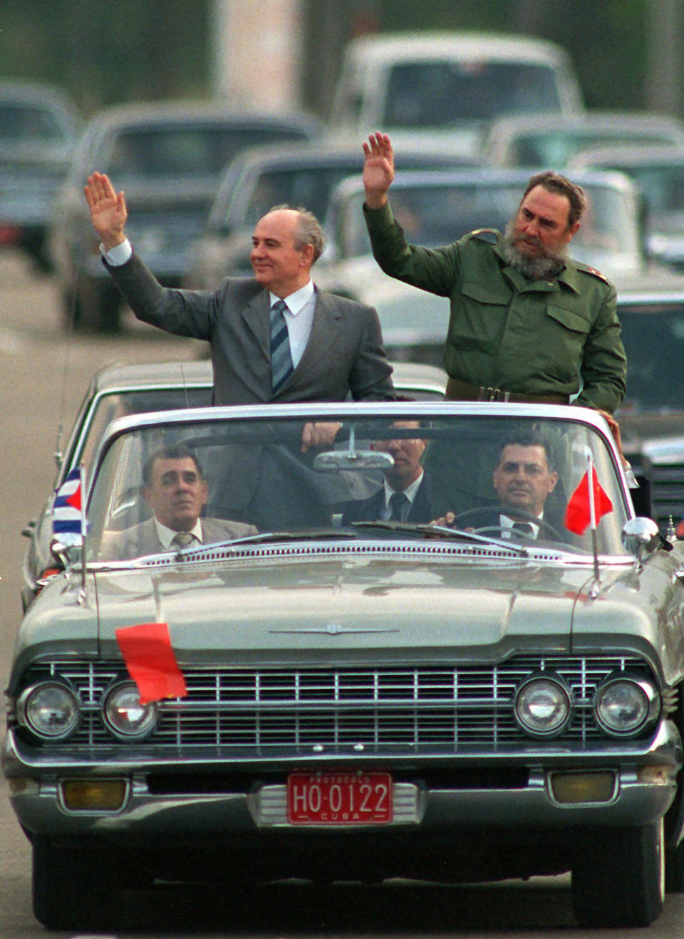 FILE - Cuban President Fidel Castro, right, and Soviet leader Mikhail Gorbachev wave to the crowd as their motorcade takes them through downtown Havana, Cuba, Monday, April 3, 1989. Russian news agencies are reporting that former Soviet President Mikhail Gorbachev has died at 91. The Tass, RIA Novosti and Interfax news agencies cited the Central Clinical Hospital. (AP Photo/Carlos Osorio, File)