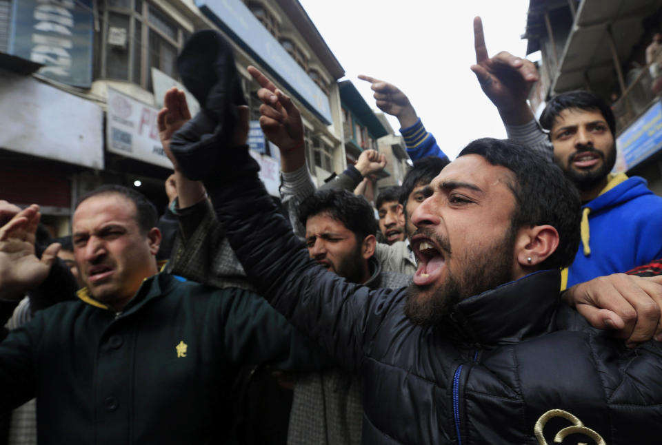 Supporters of Jammu Kashmir Liberation Front (JKLF) shout pro freedom slogans during a protest in Srinagar, India, Friday, March 7, 2014. Dozens of Muslim students from the disputed Indian territory of Kashmir were expelled from their university and briefly threatened with sedition charges because they cheered for the Pakistani cricket team during a televised match against archrival India, police said Thursday, while the Indian state's elected leader called for leniency. (AP Photo/Dar Yasin)