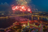 <p>Fireworks explode over the Saint Peter and Paul Fortress and the Neva River during celebration of the 72nd anniversary of the defeat of the Nazis in World War II in St. Petersburg, Russia, on May 9, 2017. (Photo: Dmitri Lovetsky/AP) </p>