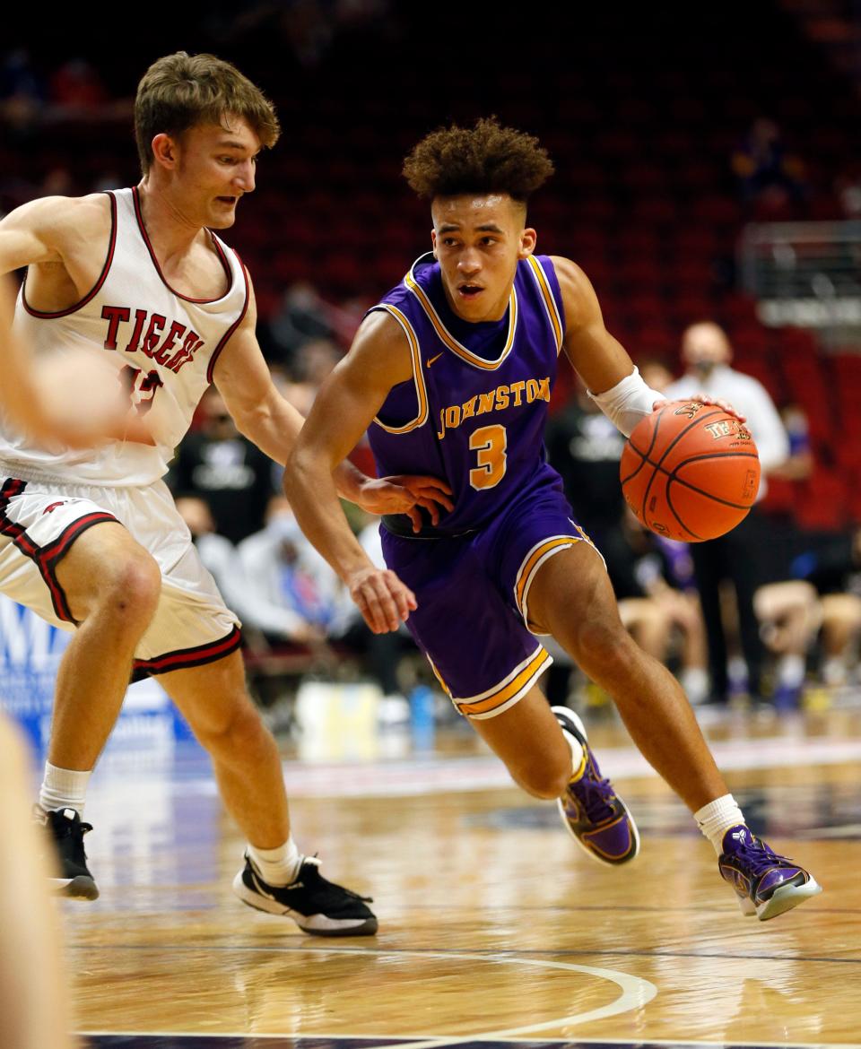 Trey Lewis of Johnston drives to the basket during the Semifinal game against Cedar Falls in Des Moines, Thursday, March 11, 2021.