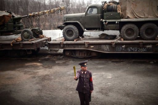 A North Korean controller is seen from the window of a train along the railway line between Pyongyang and the North Phyongan Province. North Korea is hardly known for offering a warm welcome to the world's press, and never before has it given access to a sensitive site featuring its latest space hardware