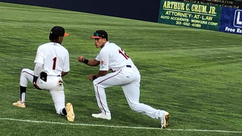 Two members of the Frederick Keys confer before Wednesday's game. How long will they be with the team?