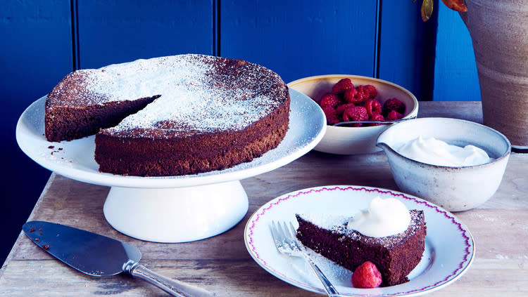 flourless chocolate-almond cake against blue wall