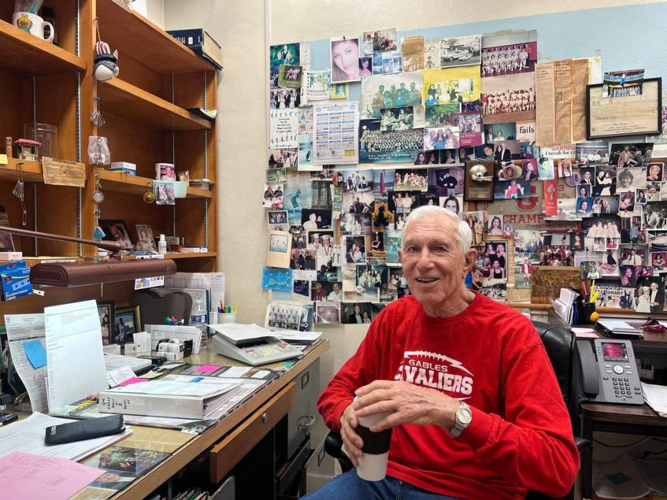 Daniel Finora, 90, of Coral Gables High School sits in his office as he celebrates his retirement after 65 years of service.