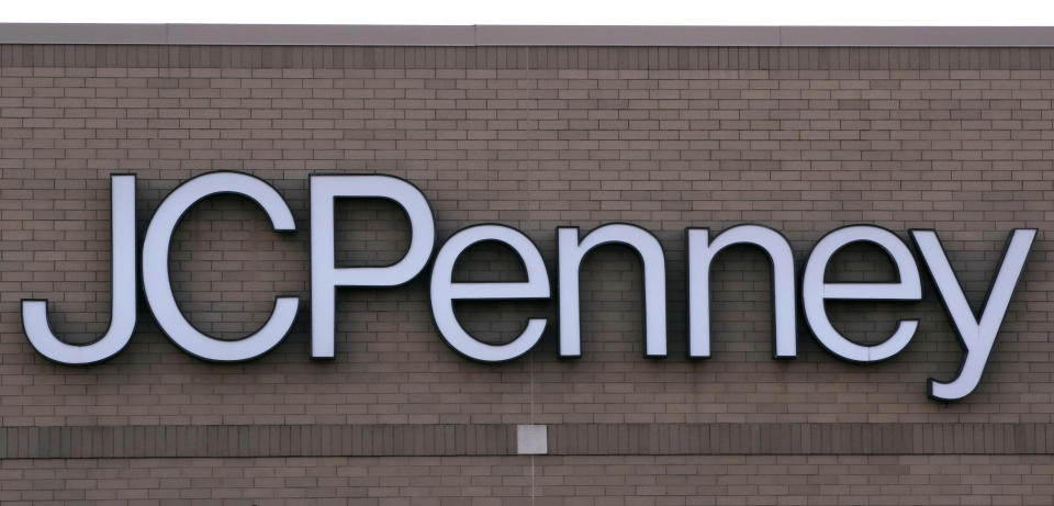 In this Wednesday, Aug. 14, 2019, photo the company logo on the building at the JCPenney store in Peabody, Mass. J.C. Penney Co. on Thursday, Aug. 15, reported a loss of $48 million in its fiscal second quarter. (AP Photo/Charles Krupa)