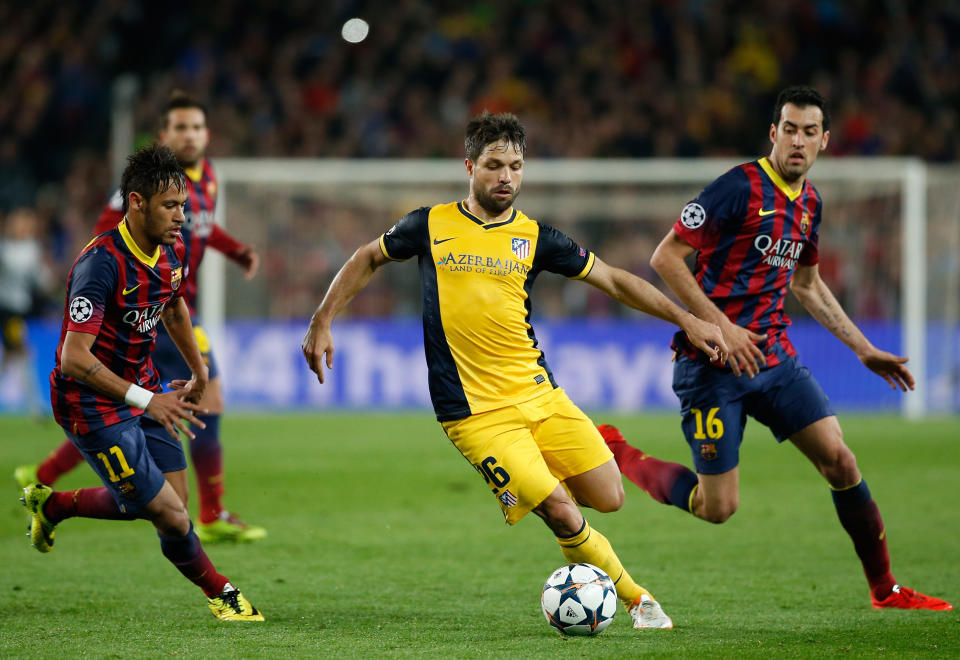 Atletico's Diego, center, drives the ball past Barcelona's Neymar, left, during a first leg quarterfinal Champions League soccer match between Barcelona and Atletico Madrid at the Camp Nou stadium in Barcelona, Spain, Tuesday April 1, 2014. (AP Photo/Emilio Morenatti)