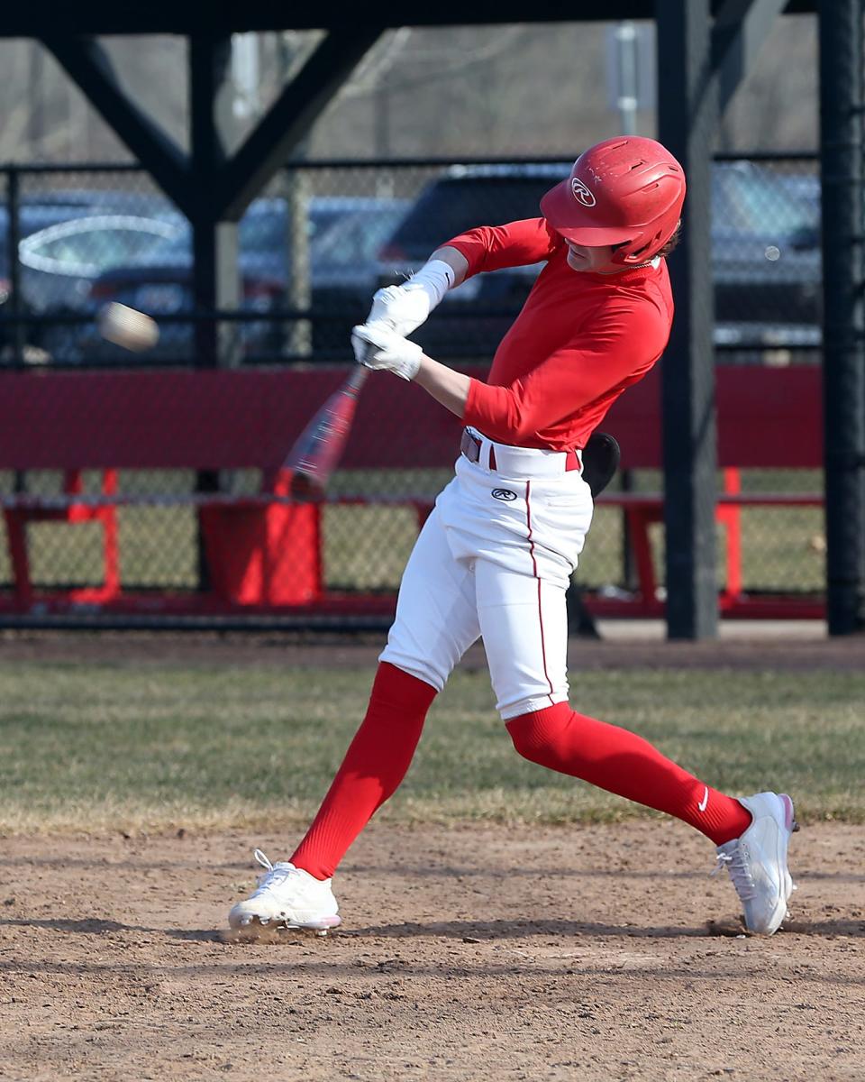 Hingham High senior Alex McGowan hits a double during a simulated game at baseball practice for spring sports at Hingham High School on Wednesday, March 22, 2023.