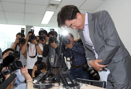 Lee Sang-moo, senior official of South Korea's tour agency 'Very Good Tour' which organized a group tour to Hungary, bows during a press conference at its headquarters in Seoul