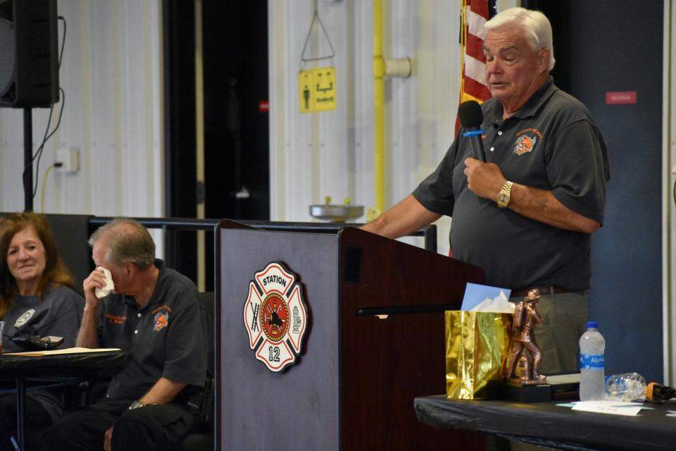 Calabash Fire Department Chief Randall Bork (right) sheds a few tears during his speech and Assistant Chief Jim Bruno wipes his eyes at their joint retirement party in Calabash on Friday, May 27, 2022.