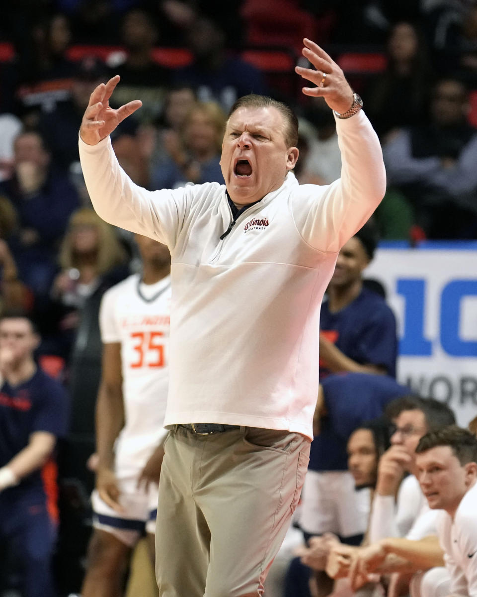 Illinois head coach Brad Underwood reacts off the bench during the second half of an NCAA college basketball game against Minnesota Wednesday, Feb. 28, 2024, in Champaign, Ill. Illinois won 105-97. (AP Photo/Charles Rex Arbogast)