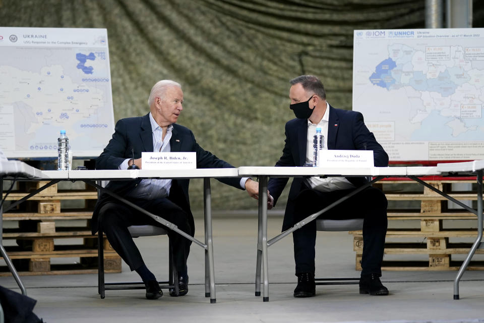 FILE - President Joe Biden and Polish President Andrzej Duda participate in a roundtable on the humanitarian response to the Russian invasion of Ukraine, March 25, 2022, in Jasionka, Poland. One year ago, Biden braced for the worst as Russia massed troops in preparation to invade Ukraine. But as Russia’s deadly invasion reaches the one year mark, Kyiv stands and Ukraine has exceeded even its own expectations. (AP Photo/Evan Vucci, File)