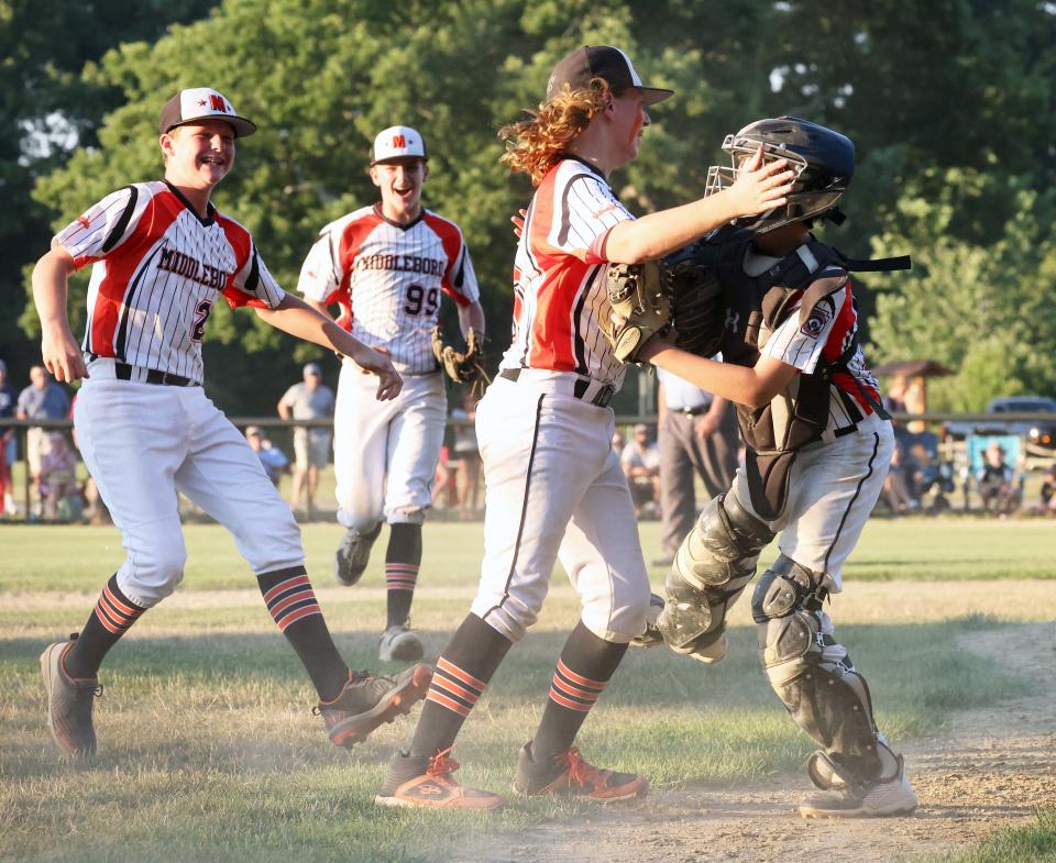 Middleboro U12 players celebrate at the conclusion of their game versus Hanover at Forge Pond Park in Hanover on Saturday, July 23, 2022. 