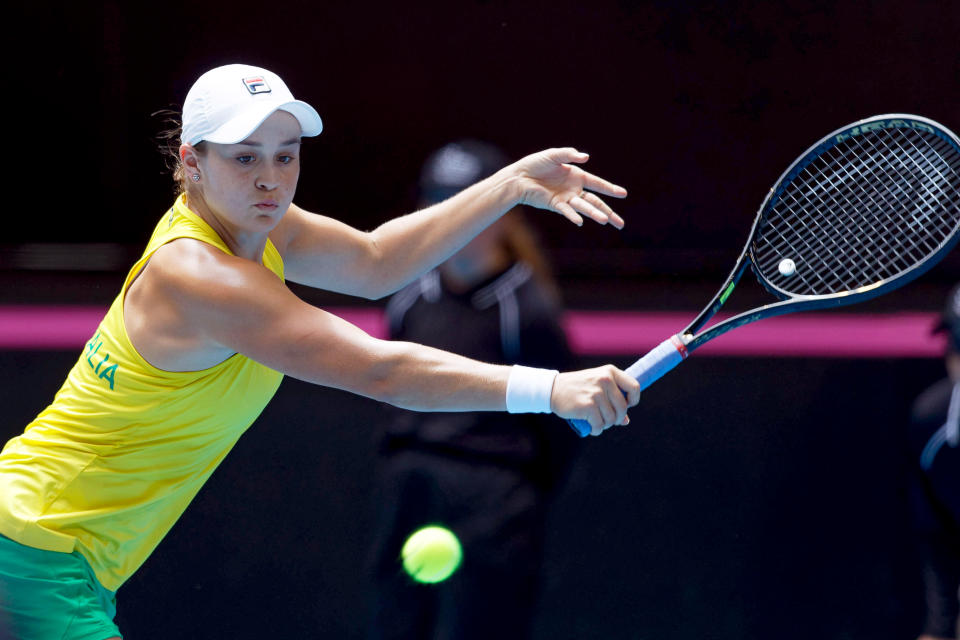 Australia's Ashleigh Barty returns to France's Caroline Garcia during their Fed Cup tennis final in Perth, Australia, Saturday, Nov. 9, 2019. (AP Photo/Trevor Collens)