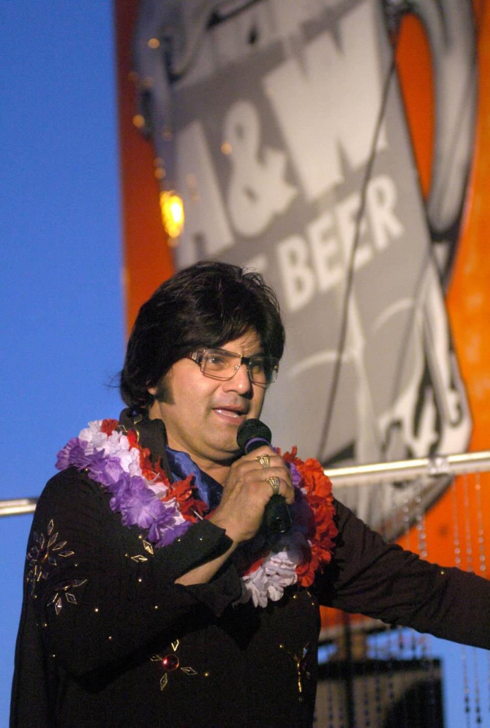 April 30, 2004. Elvis impersonator George Zavala, of Modesto, is Elvis part time and a driver for Costco. He was the MC at A & W’s Friday night performing with other Elvis impersonators also. (Debbie Noda/The Modesto Bee)