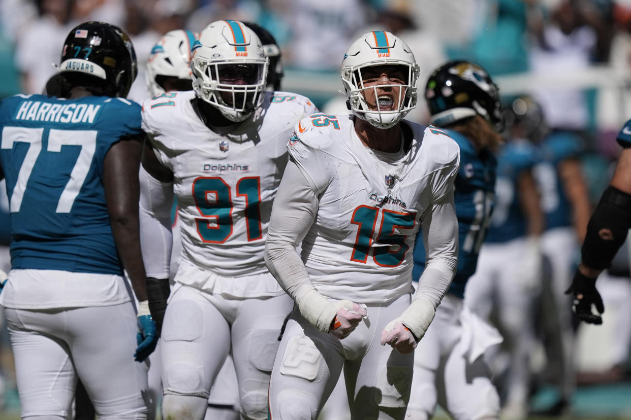 In a matchup of two high-profile quarterbacks, Jaelan Phillips (15) and the Dolphins' defense came to play Sunday, as did the Jaguars' defense. (AP Photo/Rebecca Blackwell)