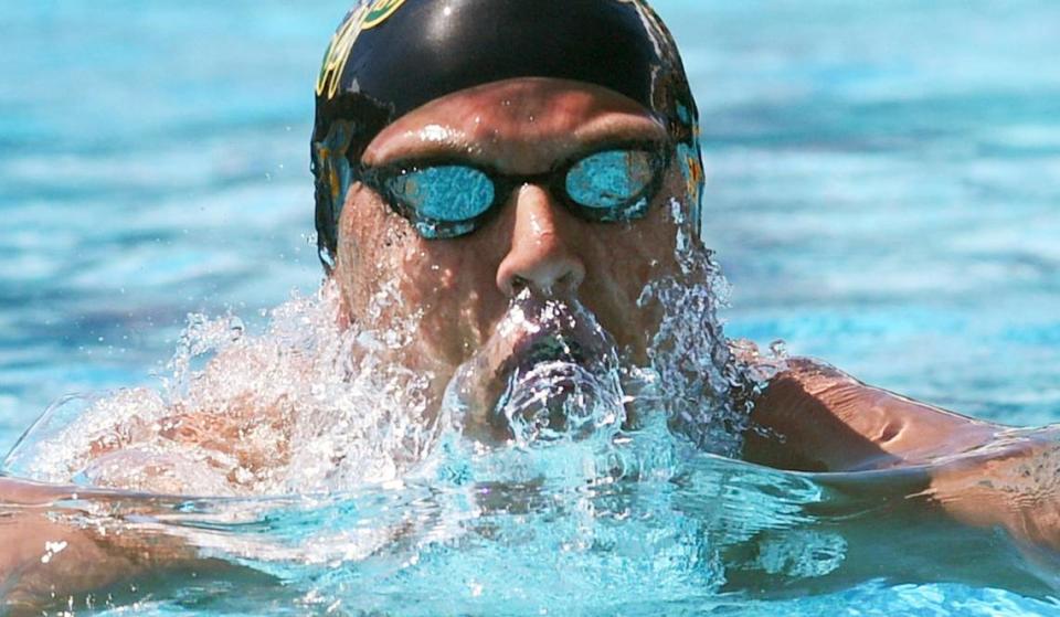 Kingsburg’s Lucas Huckabay swims to first place in heat 5 of the Boys 100 Yard Breastroke at the Clovis West Invitational Saturday, April 15, 2023 in Fresno. Clovis Unified’s Olympic Swim Complex at Clovis West opened this week after being closed almost a year for renovation and construction. ERIC PAUL ZAMORA/ezamora@fresnobee.com