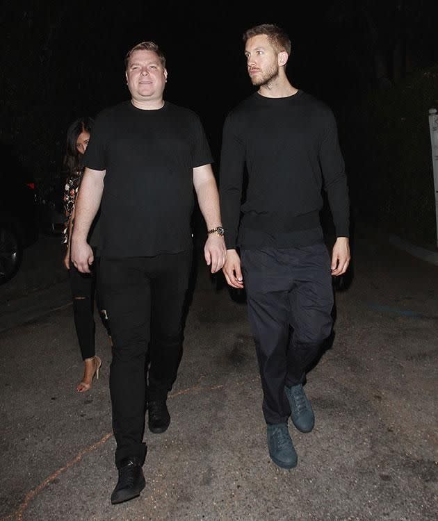 Calvin Harris and friend/bodyguard NOT to be mistaken for Eiza. Source: Splash.