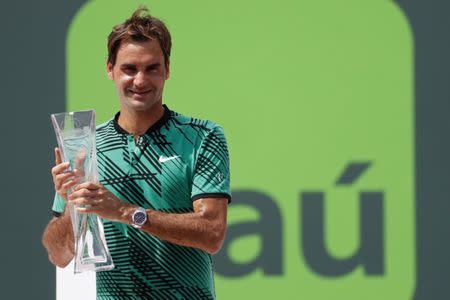 Apr 2, 2017; Key Biscayne, FL, USA; Roger Federer of Switzerland holds the Butch Buchholz trophy after his match against Rafael Nadal of Spain (not pictured) in the men's singles championship of the 2017 Miami Open at Crandon Park Tennis Center. Mandatory Credit: Geoff Burke-USA TODAY Sports