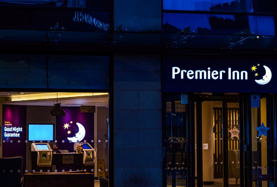 Premier Inn neon sign lit up at night, Edinburgh, Scotland, UK hotel