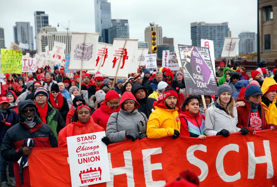 Chicago Teachers Union members and supporters march on Roosevelt Road, Wednesday, Oct. 30, 2019, in Chicago.