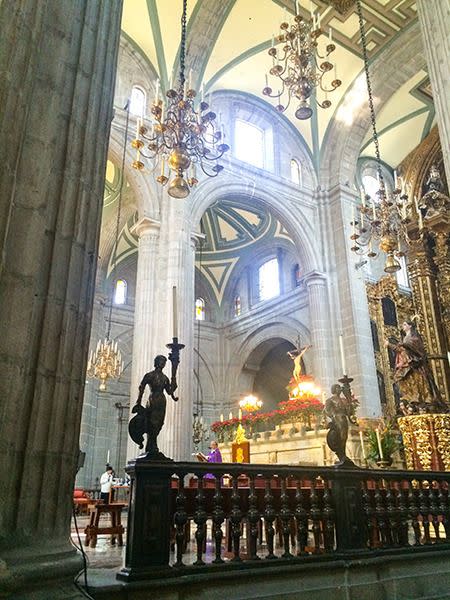 A priest saying a prayer in theMetropolitan Cathedral. Photo: Skye Gilkeson