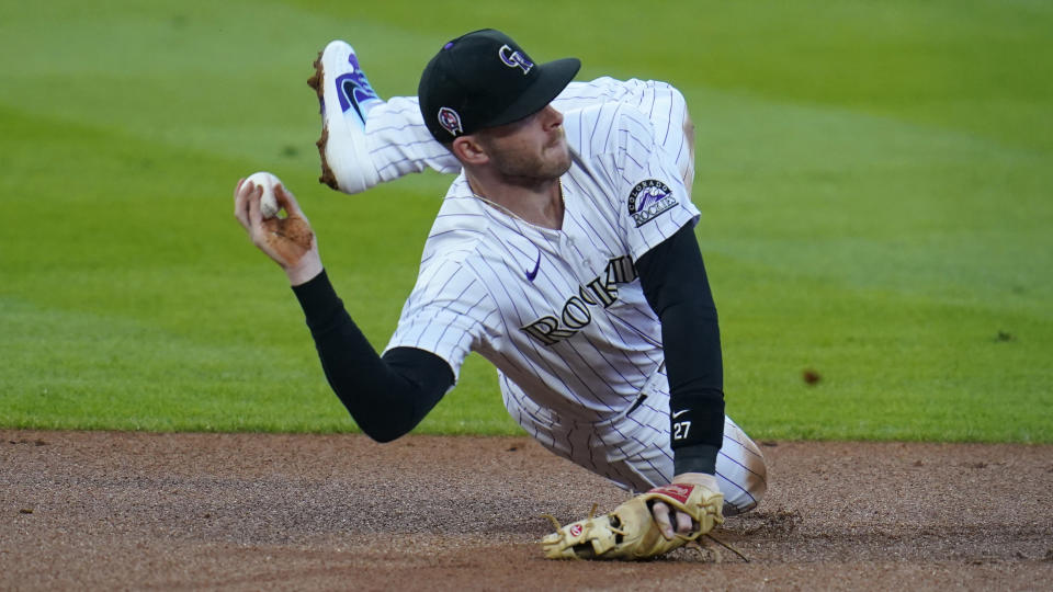 FILE - wldColorado Rockies shortstop Trevor Story throws after fielding a ground ball against the Los Angeles Angels in the first inning of a baseball game in this file photograph taken Friday, Sept. 11, 2020, in Denver. Story, who will be a free agent at the end of the 2021 season, has become the face of the Rockies with the trade of third baseman Nolan Arenado to St. Louis. (AP Photo/David Zalubowski, File)