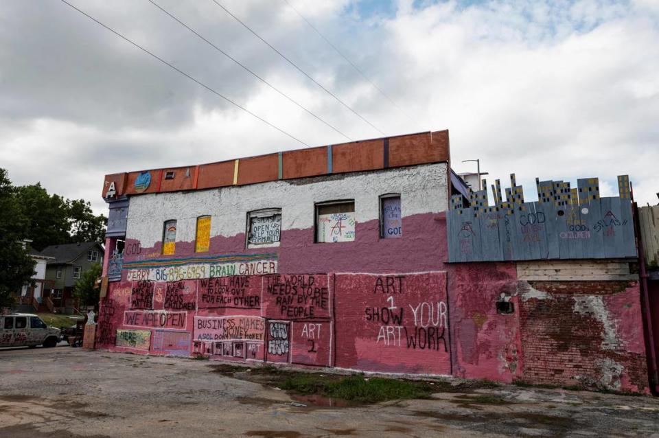 The iconic pink building on Troost Avenue in Kansas City will be removed from dangerous buildings list.