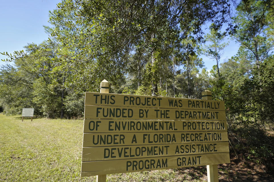 A sign is displayed inside the Flatwood Conservation Park on Friday, Oct. 22, 2021, outside Tampa, Fla. The census lists no people living in the Flatwoods Conservation Park outside Tampa, even though it says there is a home occupied by people. According to Hillsborough County spokesman Todd Pratt, two county employees live there while maintaining security for the park. (AP Photo/Chris O'Meara)