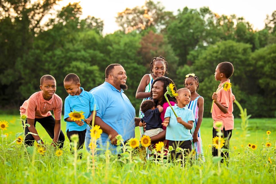 Jason and Tay with their children on the land God called him to purchase