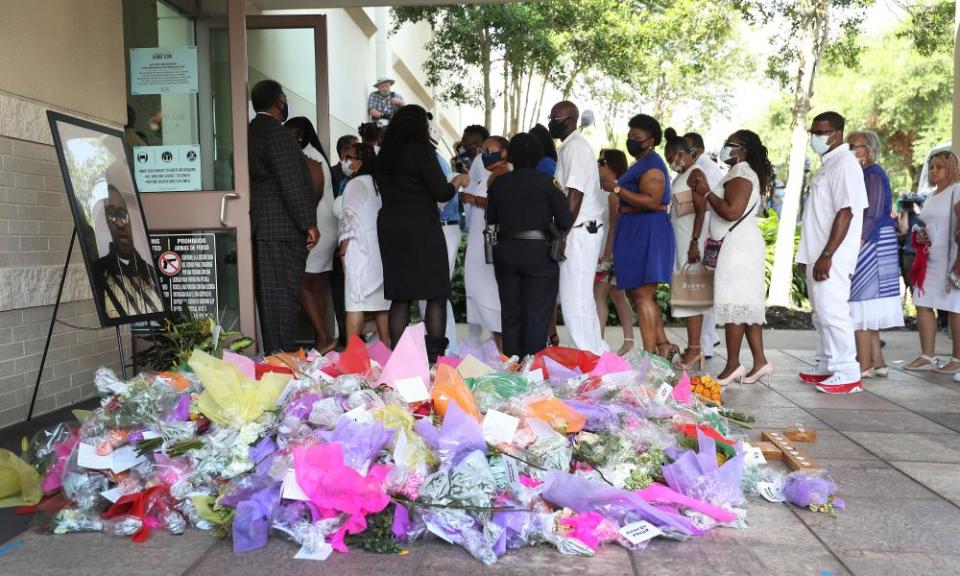 Family and friends enter the Fountain of Praise church in Houston.